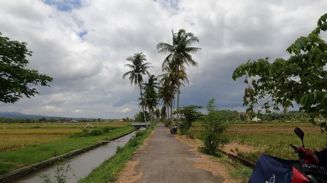 man and woman walking on the road, POV Motorcycle Riding: Java, Indonesia, South East Asia: