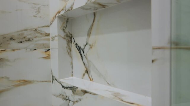 Built in marble shower niche in bathroom. Home renovation, bathroom design, real estate, modern living, interior decor, and luxury home features