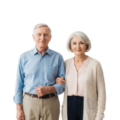 Senior couple standing together, smiling at the camera, isolated on black background.
