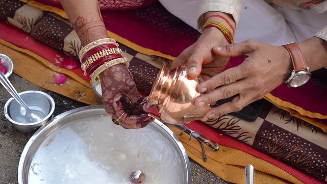 Authentic scene of a traditional Indian marriage vidhi, capturing sacred rituals performed around the holy fire (Agni) under a decorated mandap