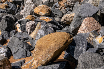 Stones for strengthening the shore in close-up.