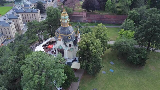 Aerial view of Hanavsky pavilon in Prague with park greenery and historic walls