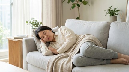 Asian woman peacefully sleeping on a cozy sofa, wrapped in a soft blanket, surrounded by indoor plants, creating a serene and comfortable home atmosphere