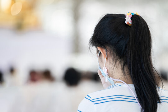 Portrait of people are meditating on Buddhist practices in the temple. People sit for meditation with peace and relax at temple or church and wearing white clothes. - Powered by Adobe