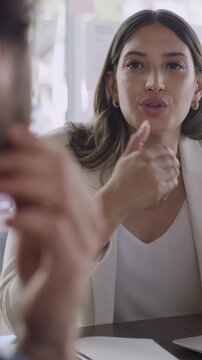 Business woman, discussion and meeting with colleague in office for company proposal or idea. Female person, employee or coworking with explanation for corporate improvement or strategy in workplace