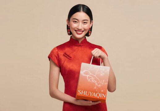 Elegant Woman Holding Gift Bag Mockup PSD