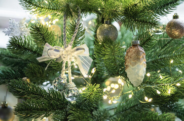 Christmas tree decorating with festive ornaments and lights