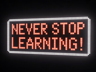 A glowing pixelated display sign conveying the inspiring message "never stop learning!"
