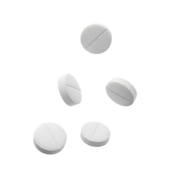 White round pills with a line, floating in mid-air on a plain background
