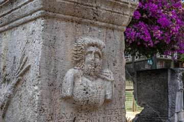An ancient bas-relief on a marble surface. Antique carvings depicting fabulous creatures. the surface of the stone. Ancient Greek myths in marble. Ruins of an ancient city.