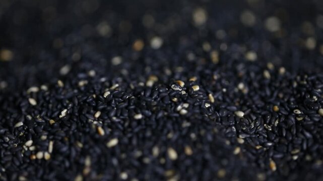 Rotating black sesame seeds, sesame oil