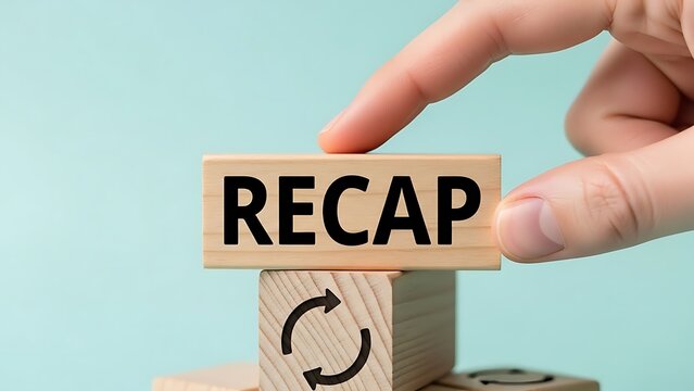 A hand placing a recap block on a rotating wooden block