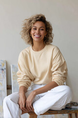 Artist in a bright studio creating a new artwork