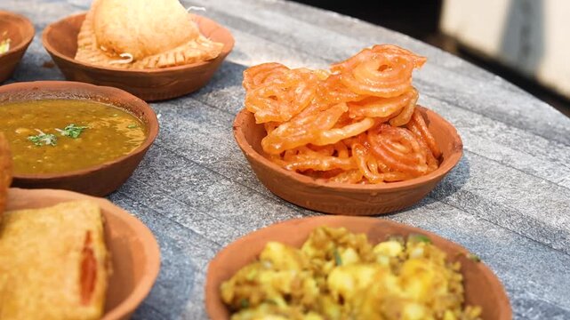 Jalebi being deep fried at a sweet shop in morning