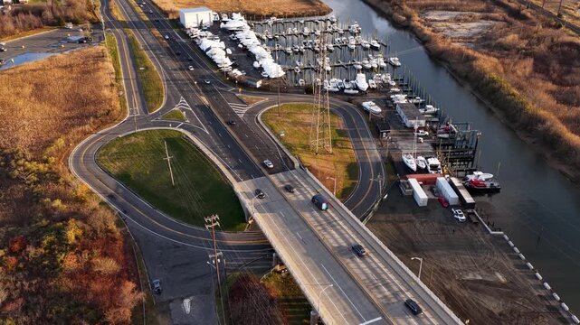 Aerial view of Cheesequake Bridge, a cloverleaf exit, and a boat marina in Old Bridge, New Jersey