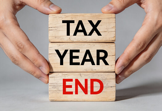 Tax year end concept idea is shown on wooden blocks financial new year income profit tax return season investment management