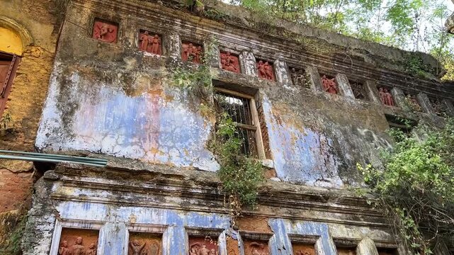 Old building with terracotta artwork of hindu gods at Narajole Palace, Midnapore, India