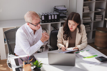 Business professionals collaborating on financial data analysis