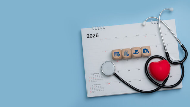 Medical, health care calendar, reminder, schedule or appointment in 2026 concept. Red heart and doctor's stethoscope with calendar on blue background. health checkup.Time management. copy space.