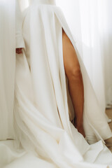 Bride wearing elegant wedding dress with high slit