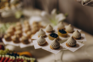 Dessert buffet table offering sweet pastries and tarts
