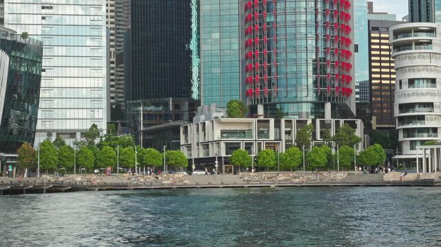 Cityscape Reflecting Water, Urban Renewal Showcasing Glass Towers And Tranquil Harbor Scenery