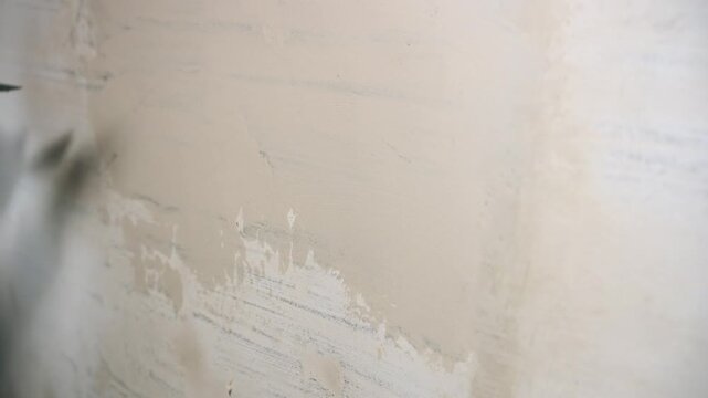 Applying Wet Compound To Wall Surface Carefully, Trowel Spreading Plaster On Wall With Uniform Coverage