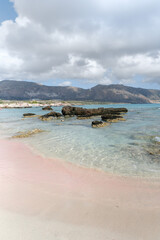 Pink Shoreline and Clear Sea in Crete, Greece
