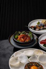 Cabbage kimchi on a plate in a restaurant on a dark background
