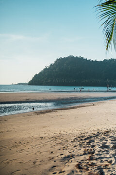 People on wide low tide beach, Ao Phrao Beach, Koh Kood, Thailand