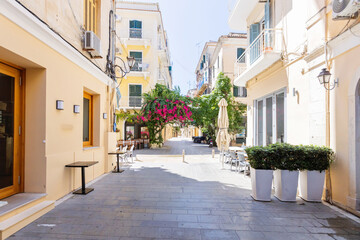 Naklejka premium Historic alley in Corfu Town, Greece, with pastel facades