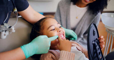 Child, consultation and dentist with mirror in office for dental checkup, show cavity and hygiene....
