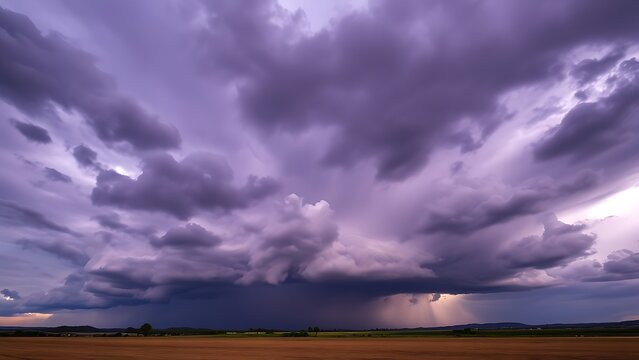 midgard. Dark purple storm clouds gathering before rainfall, dramatic sky formation, natural weather phenomenon. travel magazines, destination branding, designed for travel destination branding.