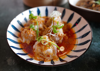 Close up dish of pork Wonton, Chinese pork and shrimp dumplings