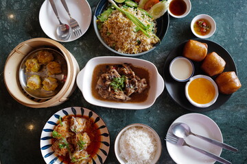 Deep fried bun served with salted egg sauce and sweet condensed milk, stir fry rice, Shumai(Chinese pork dumplings), stew ribs