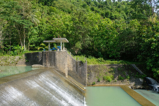 View of a river dam with a small water flow.Ecological and environmental concept. For graphic design, 3D rendering and banners