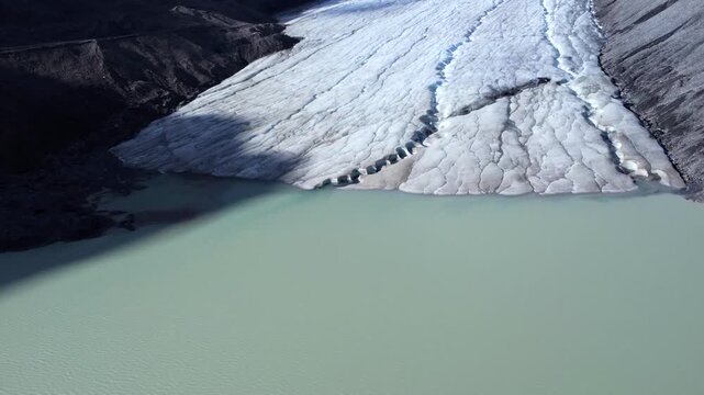 Massive athabasca glacier gradually shrinking within columbia icefield, revealing dramatic climate change impacts across canadian rockies pristine landscape through compelling visual evidence