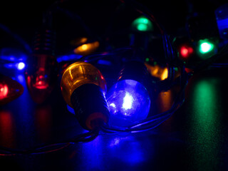 Vibrant Blue and Yellow Holiday Lights in Darkness