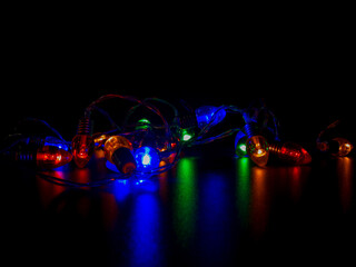 Colorful String Lights Reflecting on Dark Surface