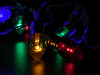 Vibrant Christmas Lights Glowing in Low Key Darkness