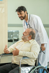 Fototapeta premium A doctor is talking to a patient in a wheelchair in a hospital.
