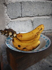 Leftover ripe banana on an enamel plate 