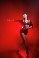 Fototapeta premium Heels dance training in red smoke studio light