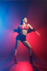 High heels dance choreography in neon smoke studio