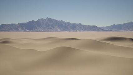Golden sand dunes roll across the horizon, with mountains gently rising in the distance. The bright blue sky contrasts beautifully with the warm tones of the desert. A serene and tranquil scene.