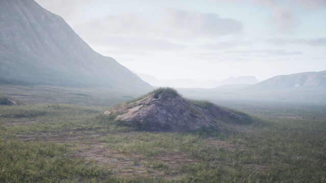 A tranquil valley stretches beneath distant mountains, with a small grassy mound in the center. Soft clouds float across a pale sky, creating a calm atmosphere. Natures beauty prevails.