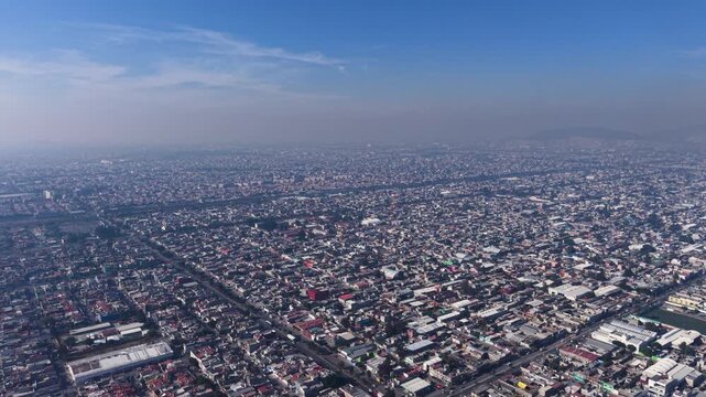 Aerial drone view of densely populated Ecatepec under smog
