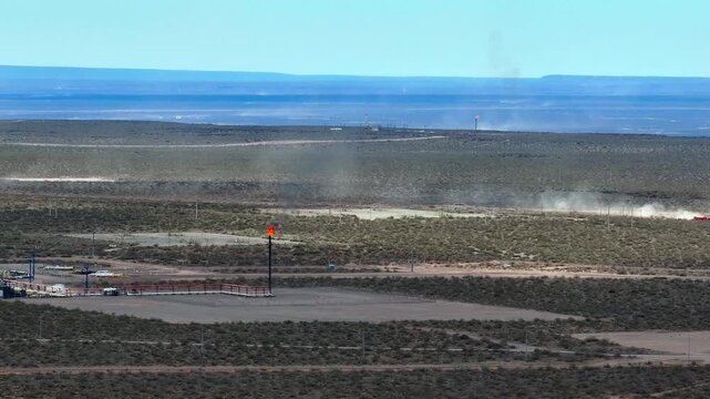 Drone flies smoothly and shows a flare with fire in the fields of A&ntilde;elo, Neuqu&eacute;n. Vaca Muerta. 4K