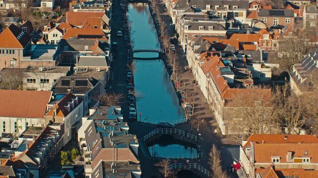 European Dutch city town landscape cityscape view from high angle with traditional authentic architecture buildings in Netherlands during sunny day in Delft, zoom in scenery