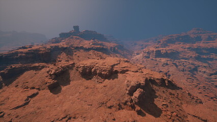 Obraz premium Stunning red rock formations rise sharply under a deep blue sky. The rugged terrain stretches endlessly, inviting adventurers to explore the natural beauty of this landscape at dusk.
